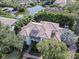 Luxury home with tile roof, surrounded by lush tropical landscaping at 4818 W San Rafael St, Tampa, FL 33629