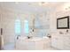 Stunning bathroom with soaking tub, double vanity, and walk-in shower at 4818 W San Rafael St, Tampa, FL 33629