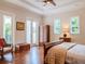 Main bedroom with hardwood floors and access to balcony at 4818 W San Rafael St, Tampa, FL 33629