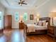 Spacious main bedroom with hardwood floors and large windows at 4818 W San Rafael St, Tampa, FL 33629