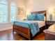 Bright bedroom with wood flooring and arched windows at 4818 W San Rafael St, Tampa, FL 33629