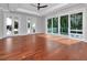 Bright and airy bedroom with hardwood floors and access to the backyard at 4818 W San Rafael St, Tampa, FL 33629