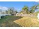 Fenced-in backyard with a large grassy area at 4918 Cresthill Dr, Tampa, FL 33615