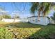 Spacious backyard, offering a large grassy area at 4918 Cresthill Dr, Tampa, FL 33615