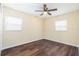 Spacious bedroom featuring wood-look floors and ceiling fan at 4918 Cresthill Dr, Tampa, FL 33615