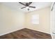 Well-lit bedroom with wood-look flooring and ceiling fan at 4918 Cresthill Dr, Tampa, FL 33615