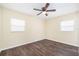 Spacious bedroom with wood-look flooring and ceiling fan at 4918 Cresthill Dr, Tampa, FL 33615