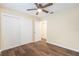 Bright bedroom with wood-look floors and double door closet at 4918 Cresthill Dr, Tampa, FL 33615