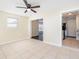 Bright dining area with tile floors and view into living room at 4918 Cresthill Dr, Tampa, FL 33615