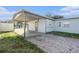 Home's exterior with covered patio and brick pavers at 4918 Cresthill Dr, Tampa, FL 33615