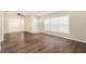 Bright living room featuring dark hardwood floors at 4918 Cresthill Dr, Tampa, FL 33615