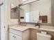 Bathroom with a vanity, toilet and large mirror at 4935 Marble Springs Cir, Wimauma, FL 33598