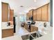 Well-equipped kitchen featuring stainless steel appliances and light wood cabinets at 4935 Marble Springs Cir, Wimauma, FL 33598