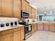 Modern kitchen with stainless steel appliances and ample counter space at 4935 Marble Springs Cir, Wimauma, FL 33598