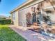 Exterior view of a screened porch with brick pavers at 4935 Marble Springs Cir, Wimauma, FL 33598