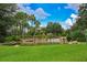 Serene pond and waterfall landscape in community at 4935 Marble Springs Cir, Wimauma, FL 33598