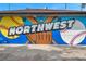 Community mural depicting baseball and softball at 5425 36Th N Ave, St Petersburg, FL 33710