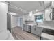 Modern kitchen with gray cabinets, white countertops, and stainless steel appliances at 5425 36Th N Ave, St Petersburg, FL 33710