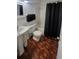 Bathroom with pedestal sink, toilet, and shower/tub combo at 5725 80Th N St # 314, St Petersburg, FL 33709