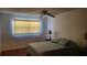 Bright bedroom with a ceiling fan and window coverings at 5725 80Th N St # 314, St Petersburg, FL 33709