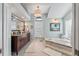 Elegant bathroom with soaking tub, double vanity, and large mirror at 5801 Leeland S St, St Petersburg, FL 33715