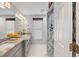 Elegant bathroom with double vanity and a nautical-themed shower at 5801 Leeland S St, St Petersburg, FL 33715