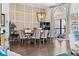 Elegant dining room with contemporary lighting and hardwood floors at 5801 Leeland S St, St Petersburg, FL 33715