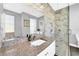 Modern bathroom with marble shower and granite vanity at 614 105Th N Ln, St Petersburg, FL 33716