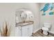 Powder room with granite vanity and decorative wall art at 614 105Th N Ln, St Petersburg, FL 33716