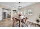 Dining area with rustic farmhouse table and kitchen view at 614 105Th N Ln, St Petersburg, FL 33716