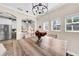 Dining room with a wood table and view of the kitchen at 614 105Th N Ln, St Petersburg, FL 33716