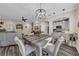 Dining room with rustic wooden table and kitchen view at 614 105Th N Ln, St Petersburg, FL 33716