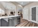 Kitchen with gray cabinets, stainless steel appliances and wine cooler at 614 105Th N Ln, St Petersburg, FL 33716