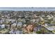 Aerial view of a waterfront home with a city skyline in the background at 660 Geneva Pl, Tampa, FL 33606