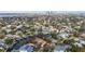 Aerial view of a house near the water with city skyline in the distance at 660 Geneva Pl, Tampa, FL 33606