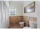 Bathroom with toilet, bidet, and window at 660 Geneva Pl, Tampa, FL 33606