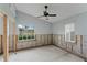 A bedroom under renovation, showing exposed framing and flooring at 660 Geneva Pl, Tampa, FL 33606