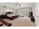 Spacious Primary bedroom with a king-size bed and access to a private balcony at 660 Geneva Pl, Tampa, FL 33606