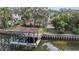 Private boat dock with covered seating area and lift, on the water at 660 Geneva Pl, Tampa, FL 33606