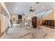 Living room with water damage and exposed framing; renovation in progress at 660 Geneva Pl, Tampa, FL 33606