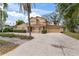 Two-story house with stucco exterior, tile roof, and attached garage at 660 Geneva Pl, Tampa, FL 33606