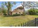 Two-story house with lush landscaping and a large yard at 660 Geneva Pl, Tampa, FL 33606