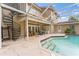 Inviting pool area with covered patio and spiral staircase at 660 Geneva Pl, Tampa, FL 33606