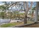 Scenic waterfront view from a screened porch, showing a dock and boats at 660 Geneva Pl, Tampa, FL 33606