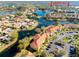 Aerial view of a community surrounded by lakes and mature landscaping and parking at 6816 Dali Ave # E206, Land O Lakes, FL 34637