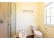 Clean bathroom with a glass-enclosed shower, toilet, and bidet at 6816 Dali Ave # E206, Land O Lakes, FL 34637