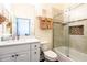 Bathroom featuring a shower with glass door and vanity with storage at 6816 Dali Ave # E206, Land O Lakes, FL 34637