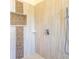 Shower with beige tile and mosaic accents at 6816 Dali Ave # E206, Land O Lakes, FL 34637