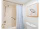 Bathroom with shower/tub combo and blue shower curtain at 7 Elgin Pl # 512, Dunedin, FL 34698