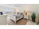 Bedroom with white dresser and ocean view at 7 Elgin Pl # 512, Dunedin, FL 34698